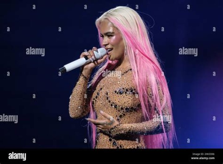 Singer, Karol G suffers embarrassing fall on stage while performing in Miami (video)